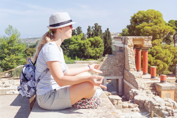 a woman sitting on a bench